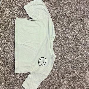 light green smiley shirt